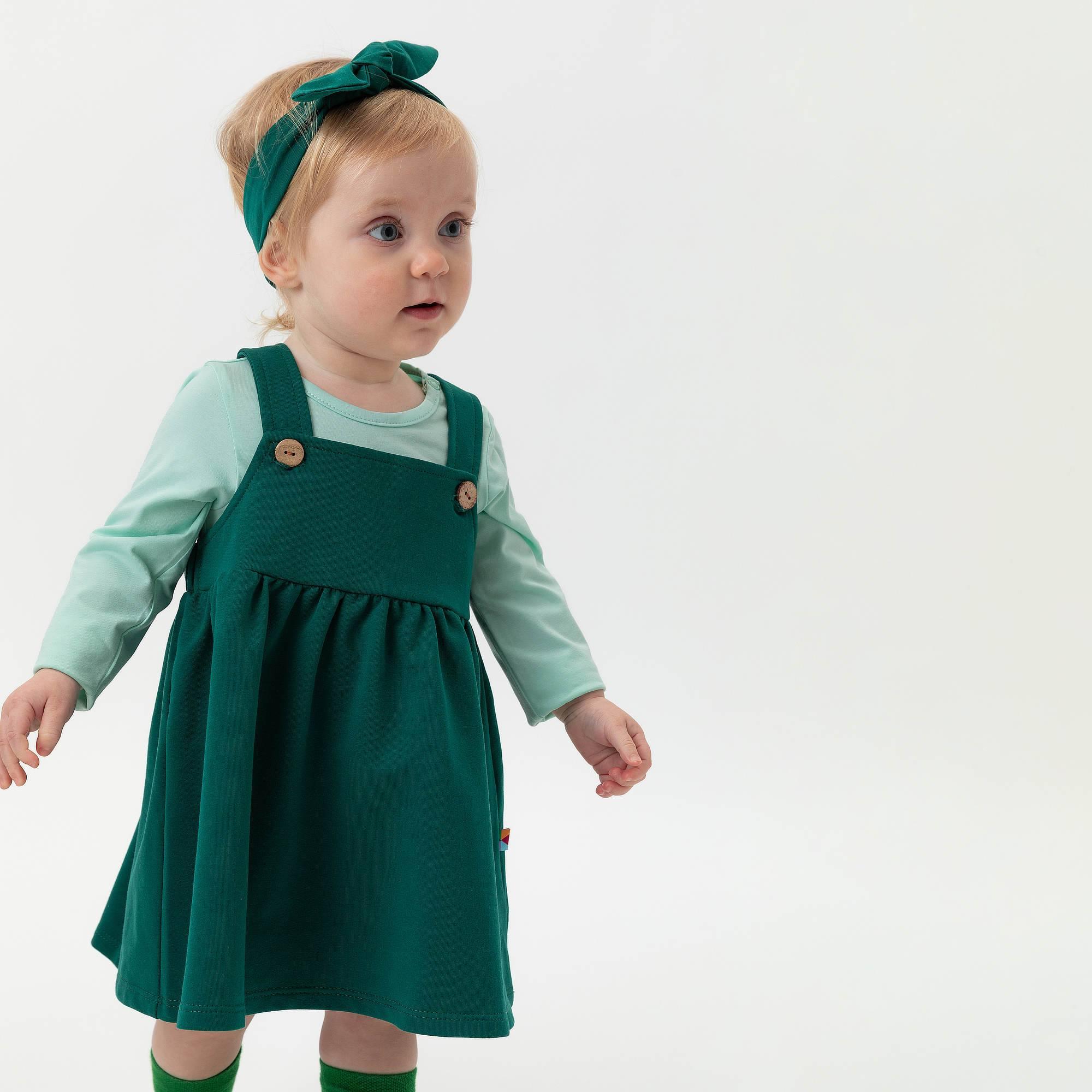 Bottle-green dungaree dress