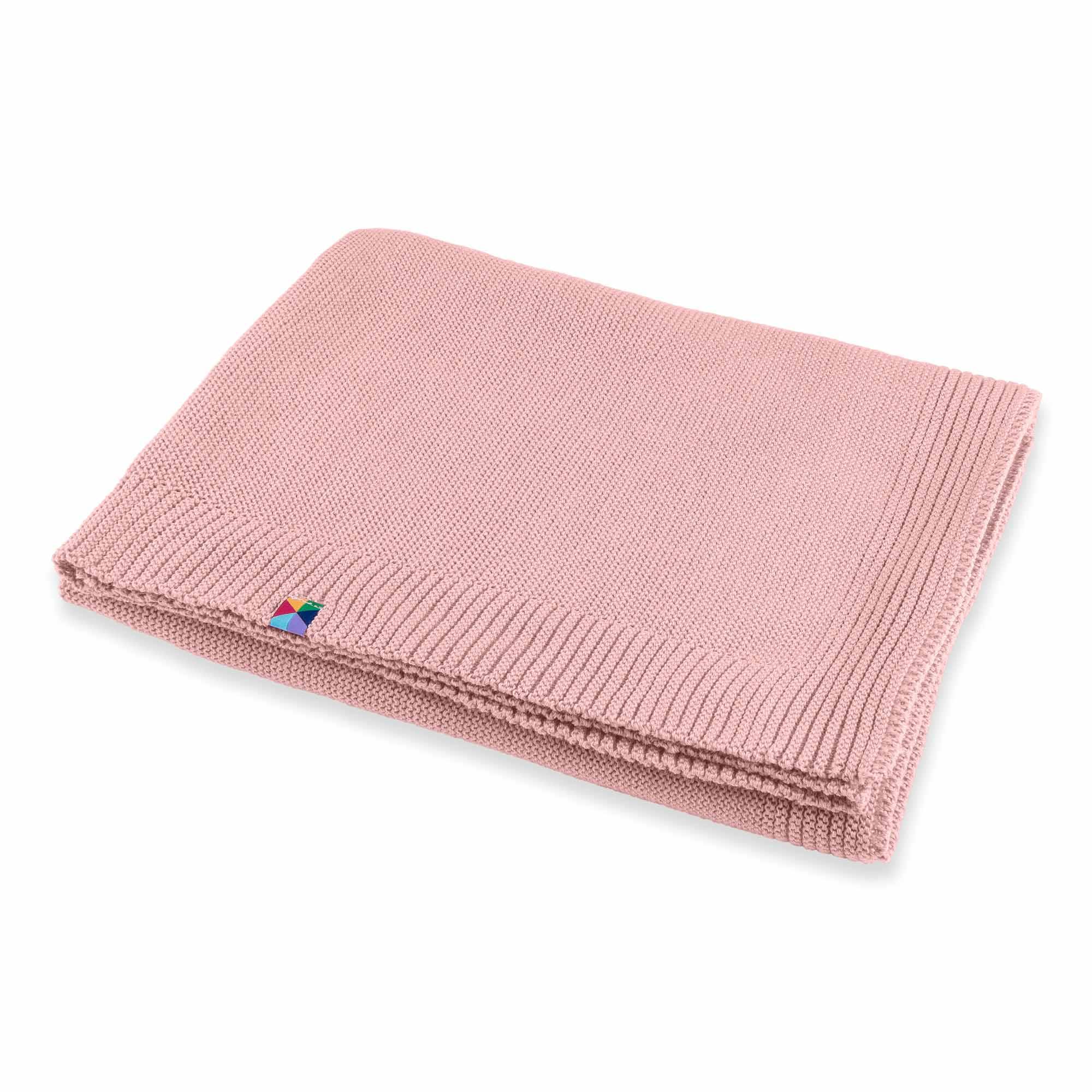 Pastel pink merino wool knitted blanket