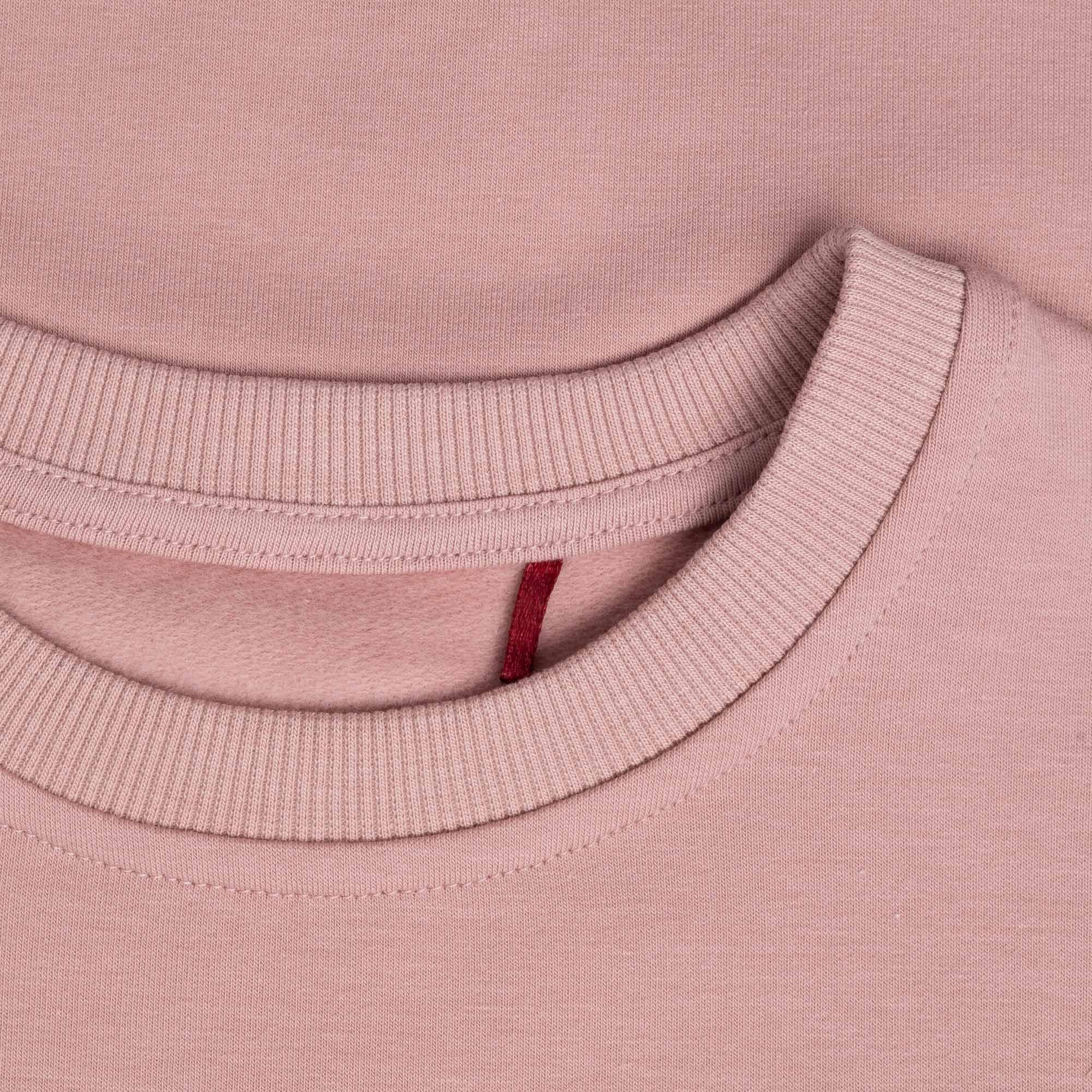 Pastel pink fleece-lined sweatshirt